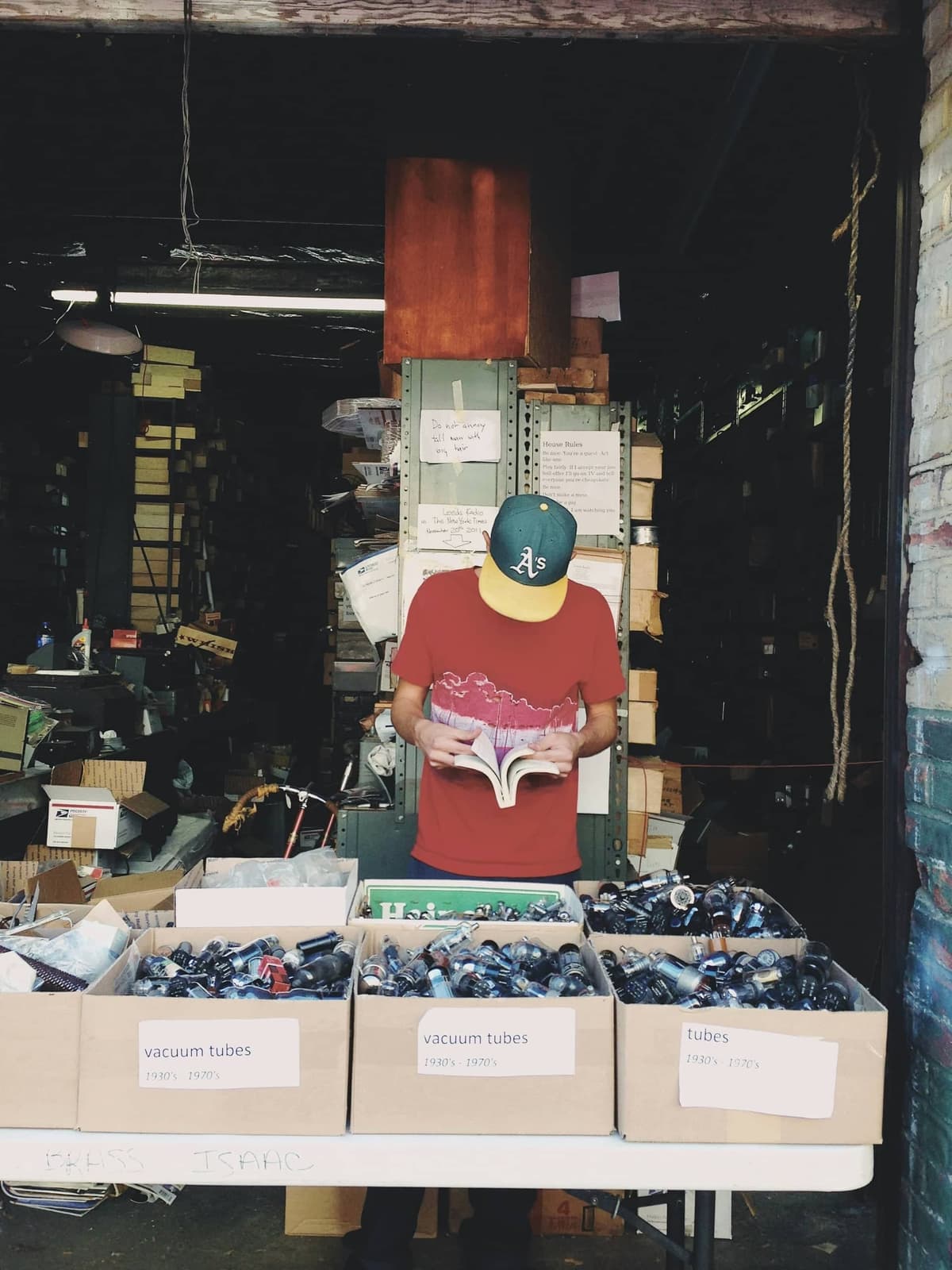 Colorful yard sale display with hats and vintage items